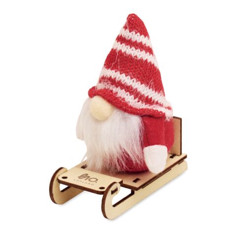 Lutin sur un traîneau en bois