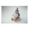 Lutin sur un traîneau en bois gris