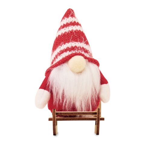 Lutin sur un traîneau en bois rouge